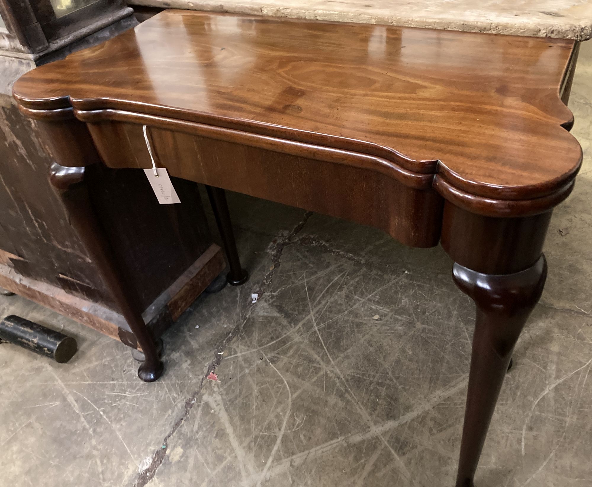 An 18th century mahogany folding card table, width 81cm, depth 38cm, height 71cm